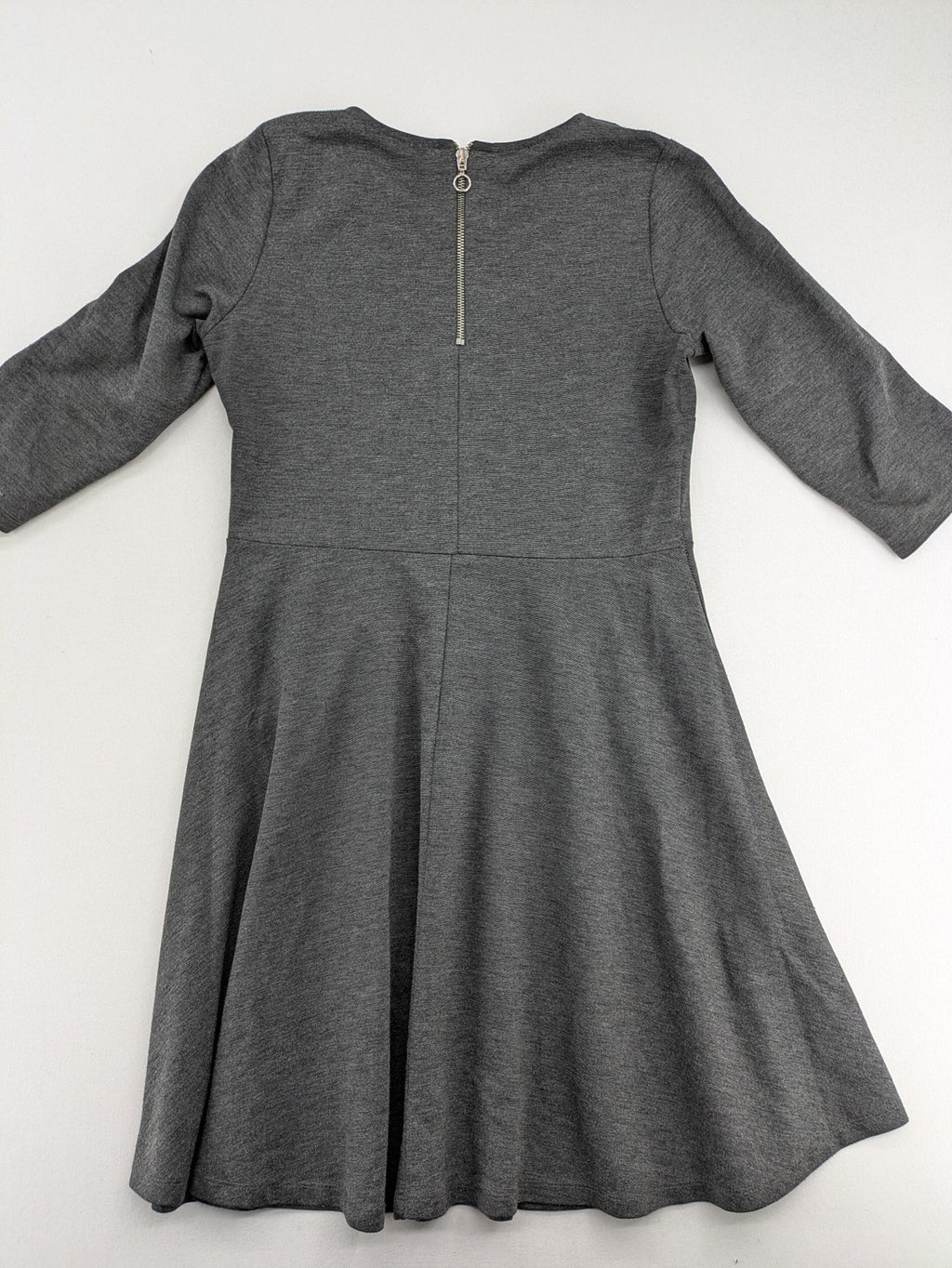 Ginatricot grey A-line skater dress with 3/4 sleeves and visible back zipper.