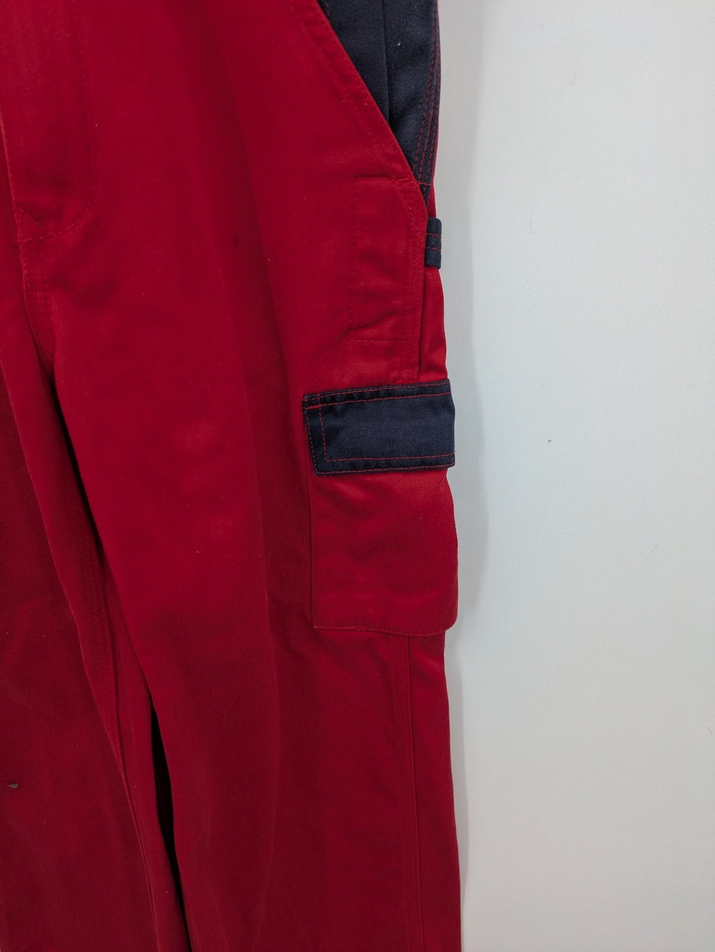 Grene navy red overall with adjustable straps, multiple pockets, and durable material.