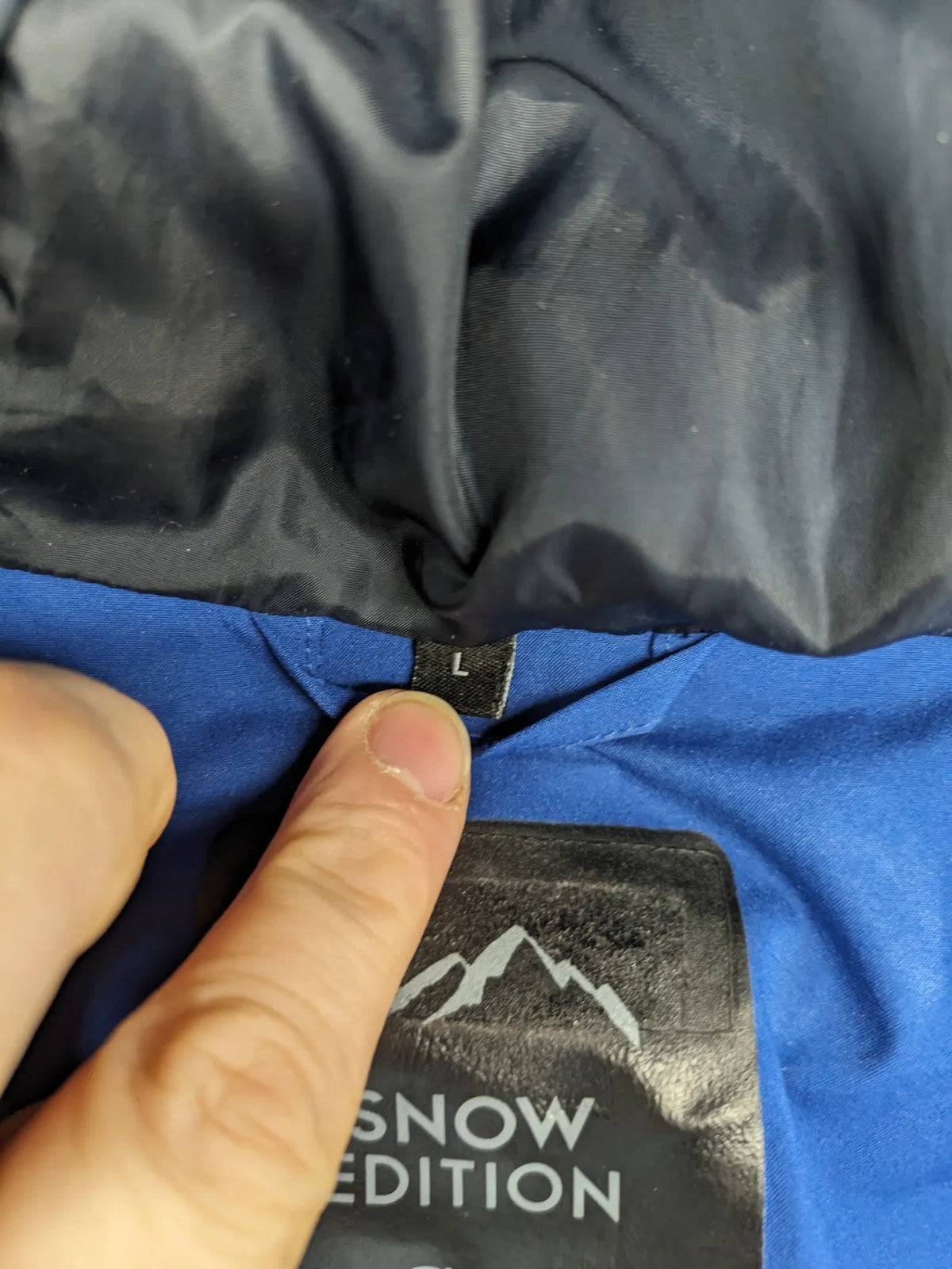 C&A blue winter jacket with hood, zip closure, and multiple pockets, used condition.