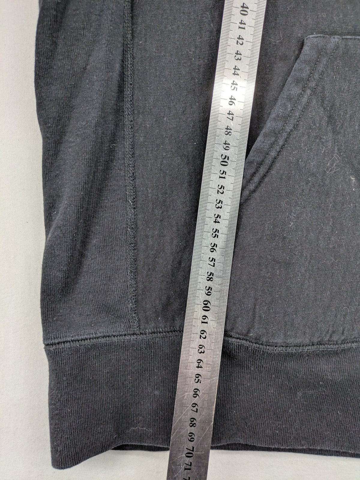Supreme grey hoodie with embroidered small box logo, kangaroo pocket, and ribbed cuffs.