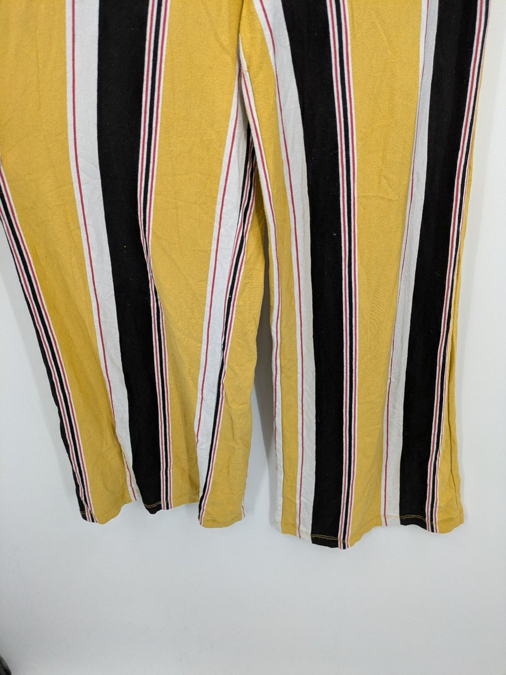 Bershka multi jumpsuit vertical striped pattern yellow, black, white, knot detail, cut-out waist.