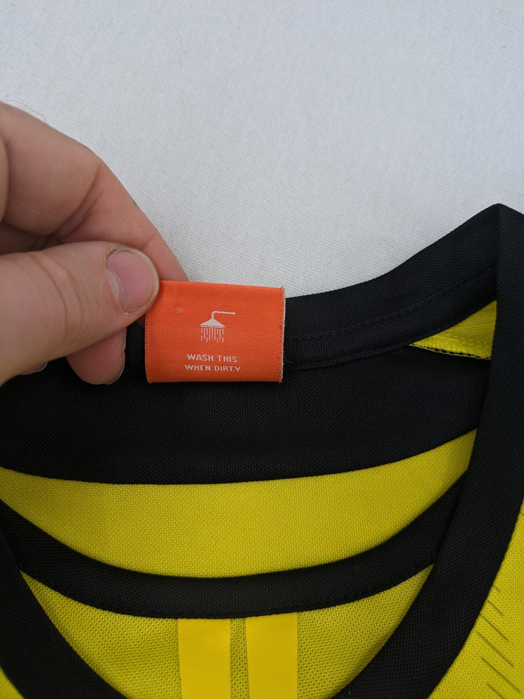 Borussia Dortmund black and yellow soccer uniform with DFB Pokal 2014 patch and Puma logo.