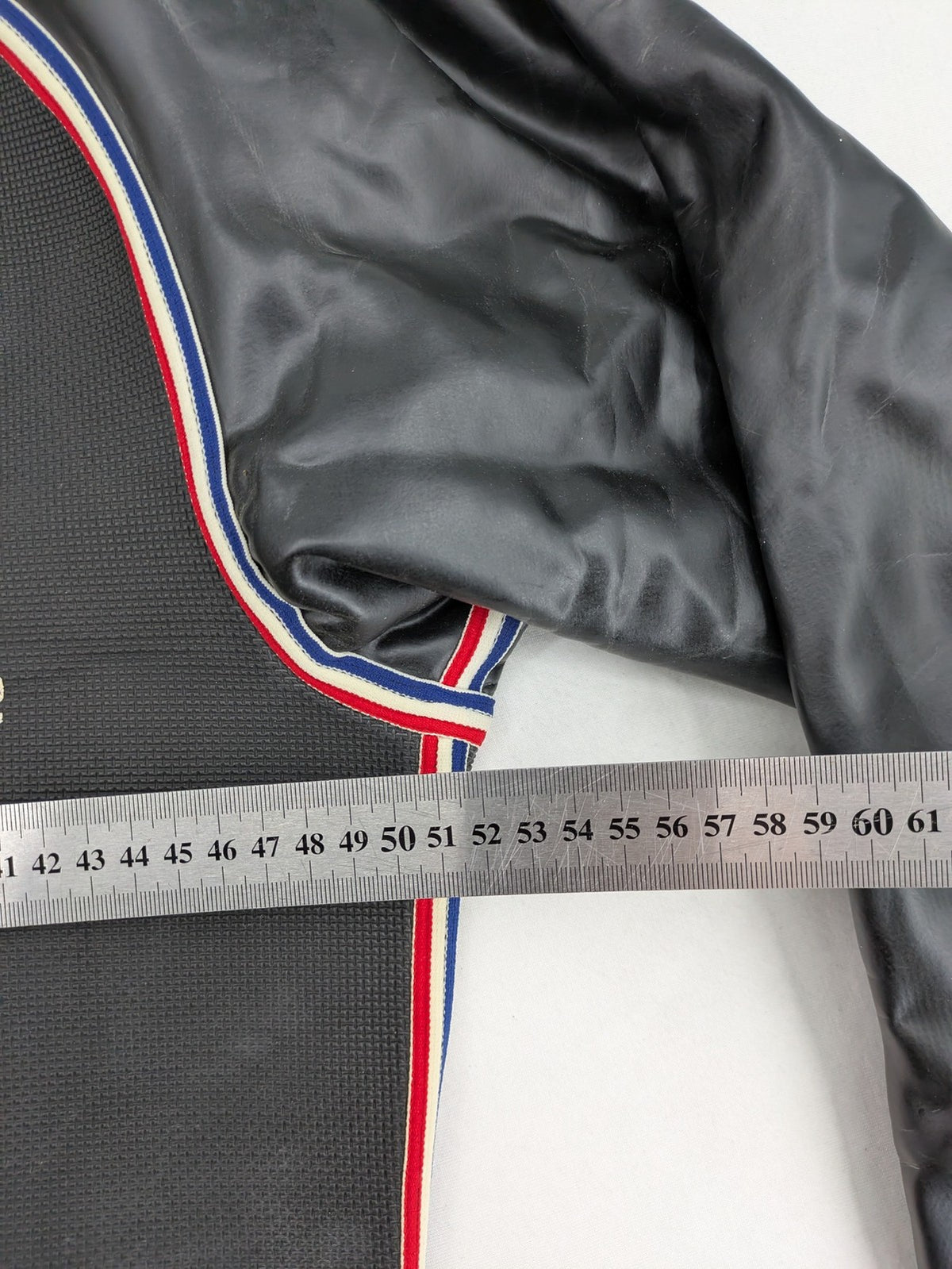 Camaro vintage jacket multi-colour with striped accents and structured body.