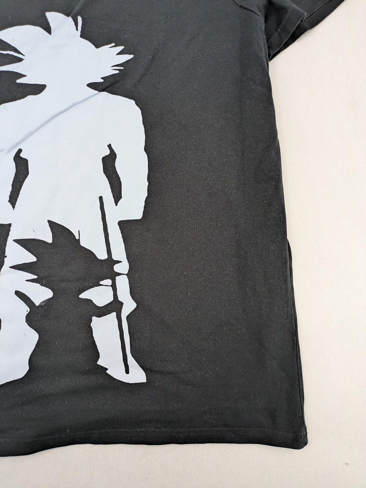 Dragon Ball Z black t-shirt featuring blue Son Goku silhouette graphic design.