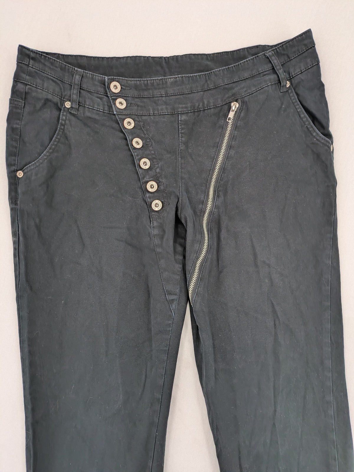 REI grey pants asymmetrical design with diagonal zipper and button placket, cotton blend.