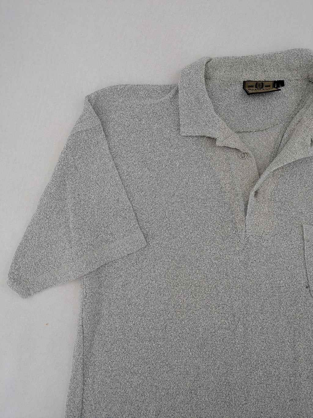 Headlands grey short sleeve polo shirt textured terry fabric with chest pocket.