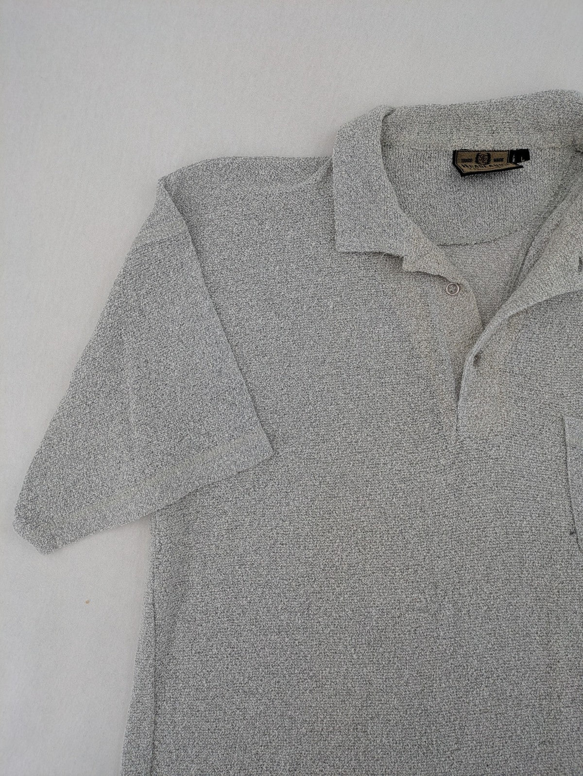 Headlands grey short sleeve polo shirt textured terry fabric with chest pocket.
