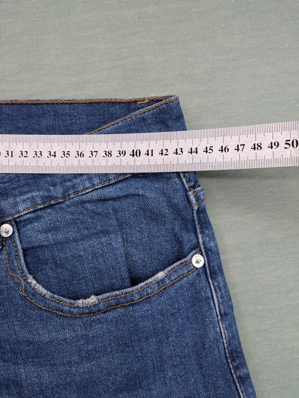 Zara blue straight jeans with medium wash, lightweight denim, and regular fit.