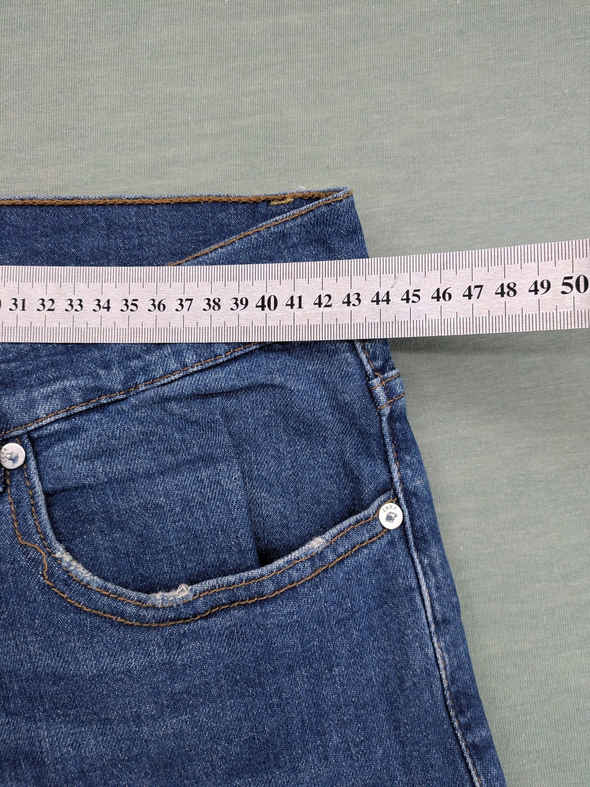 Zara blue straight jeans with medium wash, lightweight denim, and regular fit.