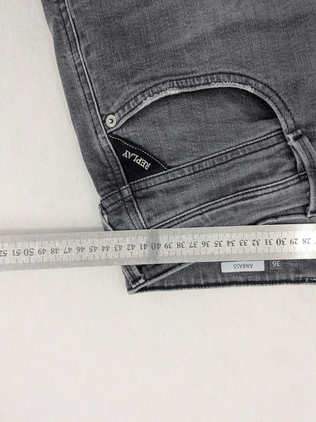 Replay grey straight jeans faded wash five-pocket style with logo on pocket.