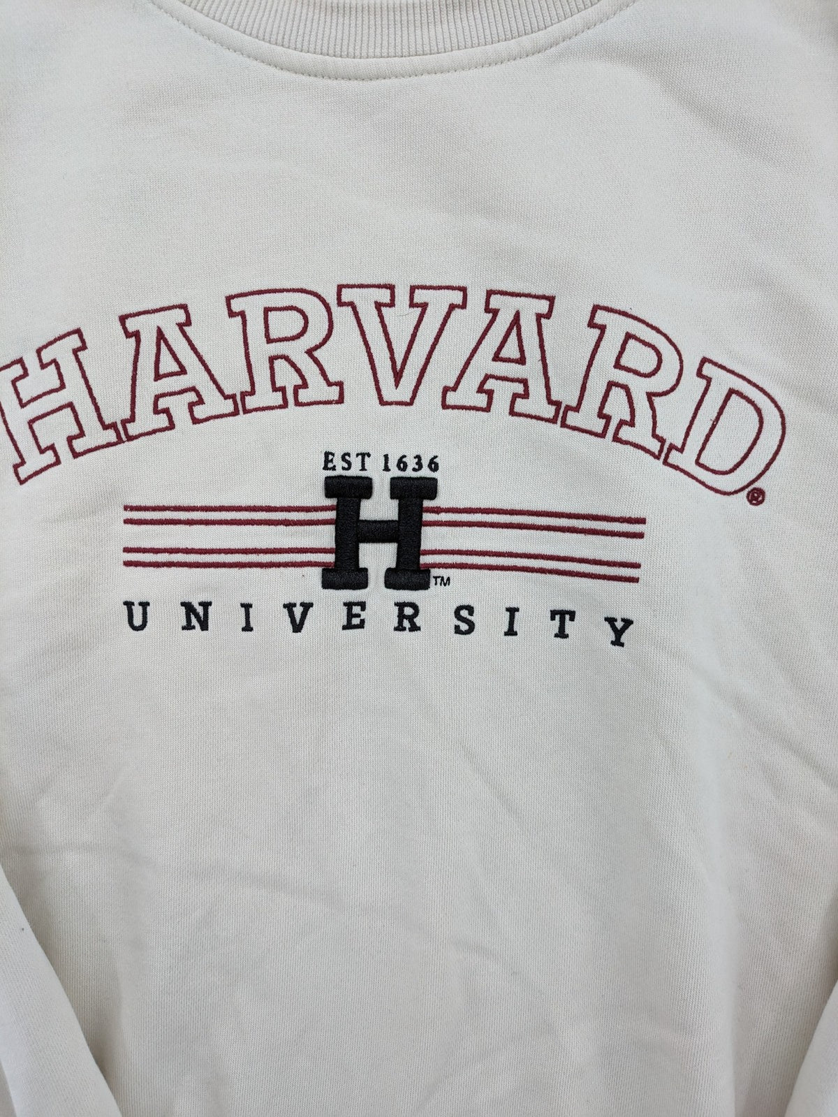 H&M cream turtle neck jumper embroidered Harvard University logo, soft cotton blend.