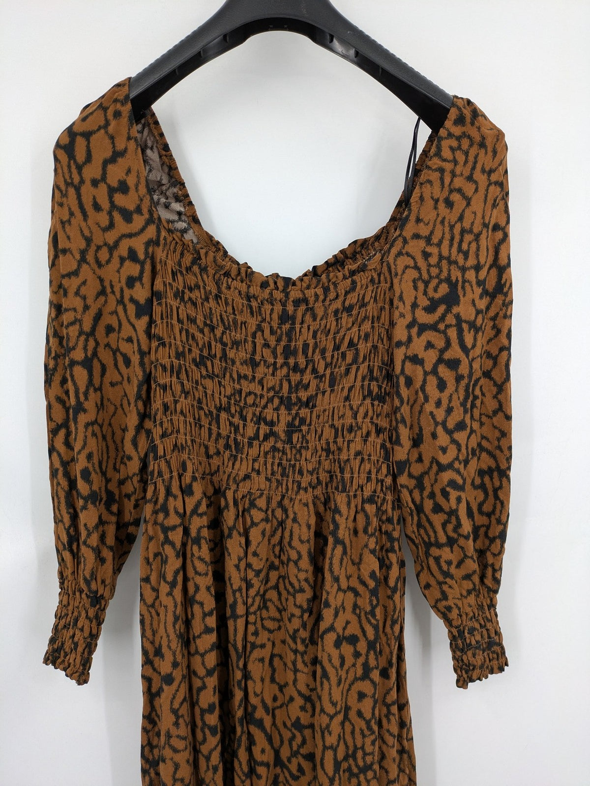 H&M brown and black animal print midi dress with smocked bodice and square neckline.