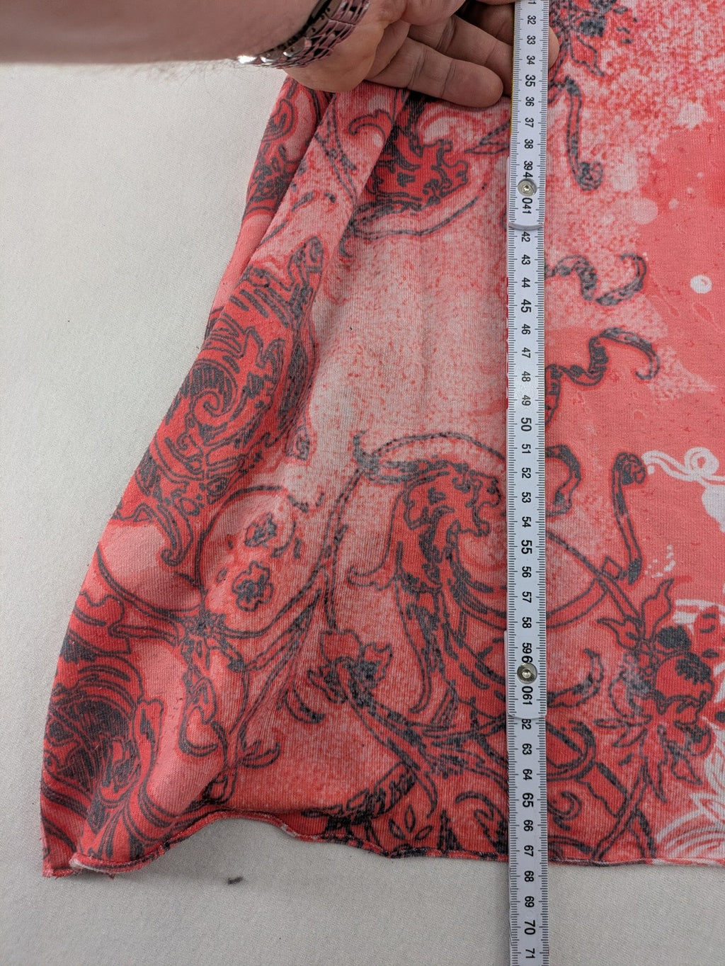TREDY pink graphic top with rose and wings design, embellished with rhinestones.
