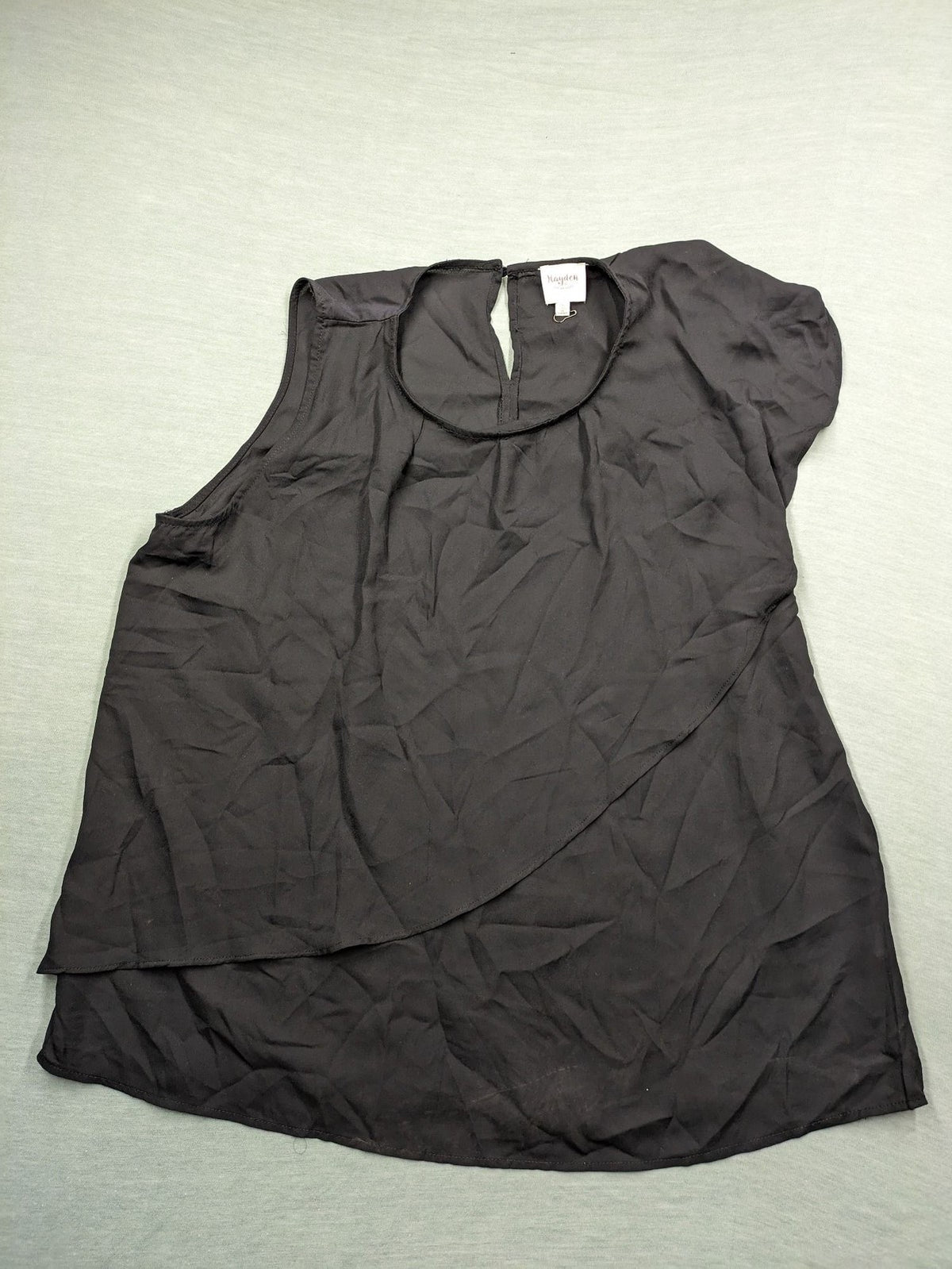 Hayden pink top asymmetrical layered design with ruffle detail, made of 100% polyester.