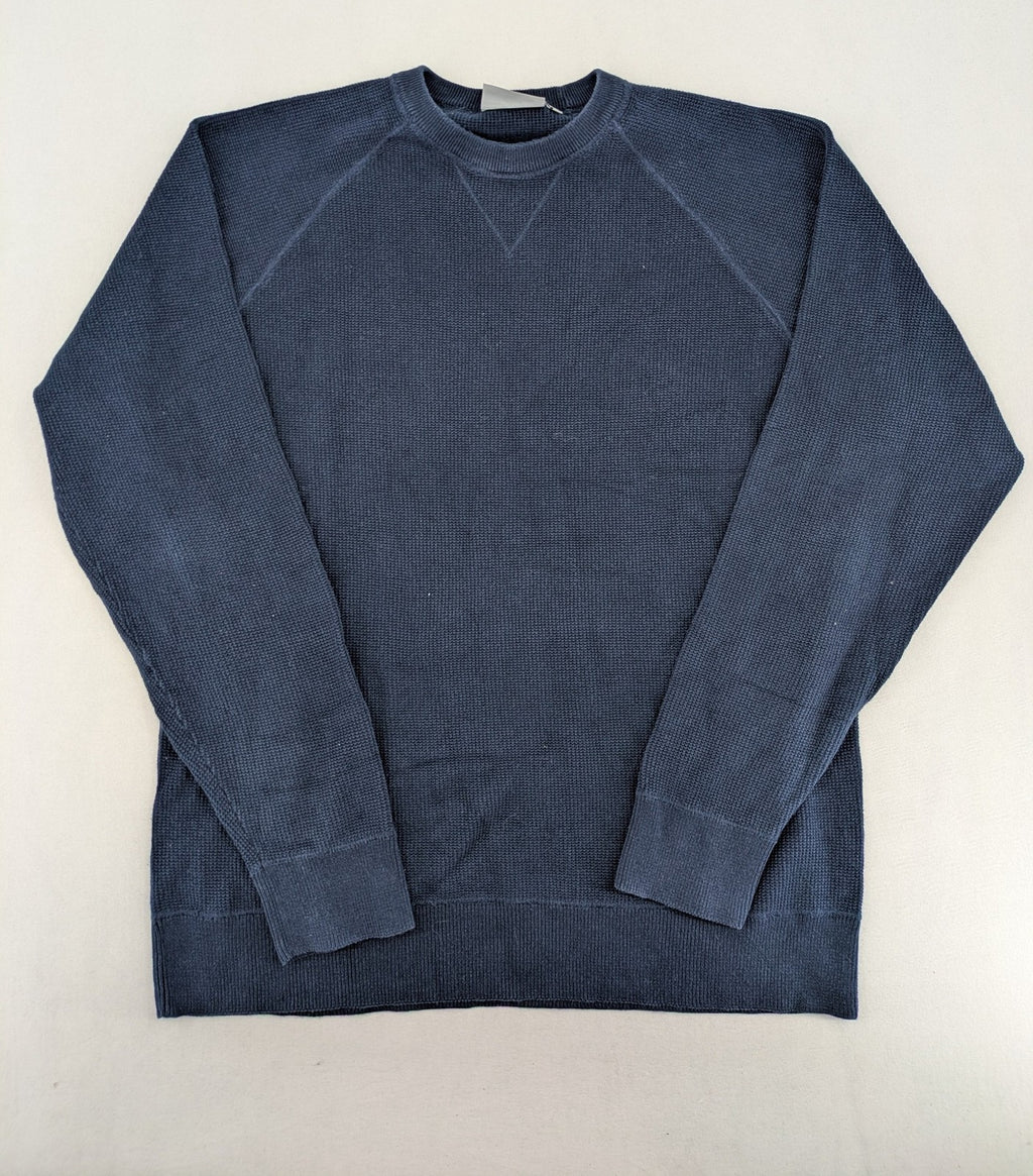 Carhartt navy turtle neck jumper waffle knit texture with subtle logo on sleeve.