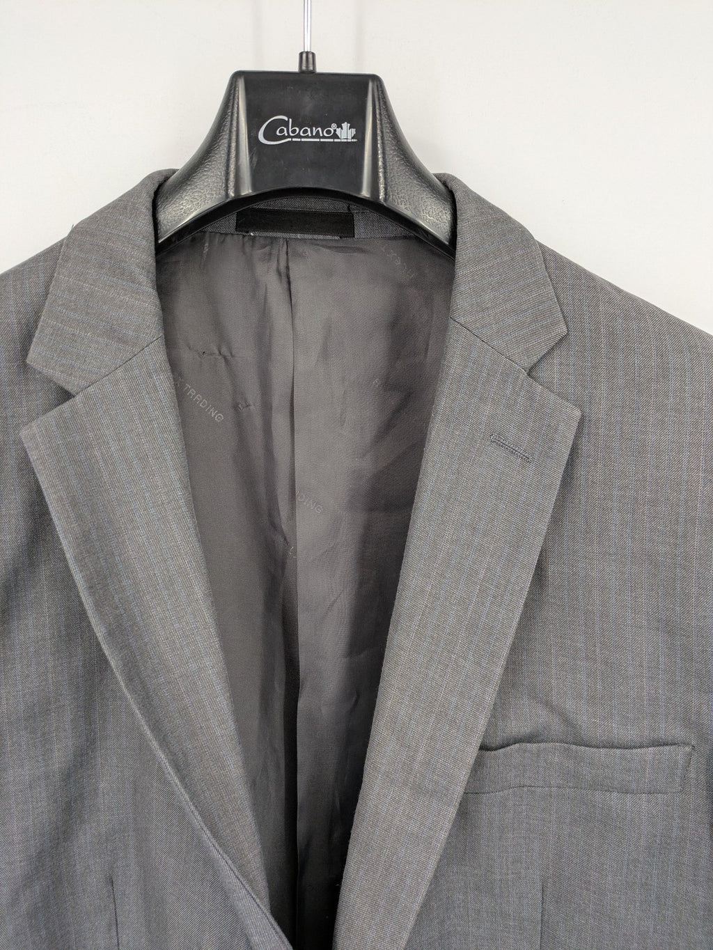 Alextrading grey jacket with subtle light blue pinstripe pattern and notch lapels.