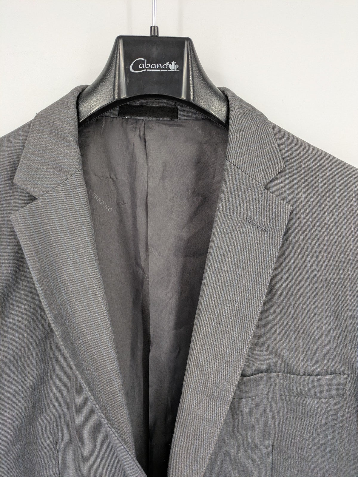 Alextrading grey jacket with subtle light blue pinstripe pattern and notch lapels.