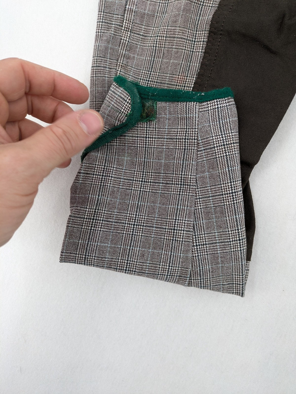 Cavallo grey check riding pants with brown full-seat patch and logo detail.
