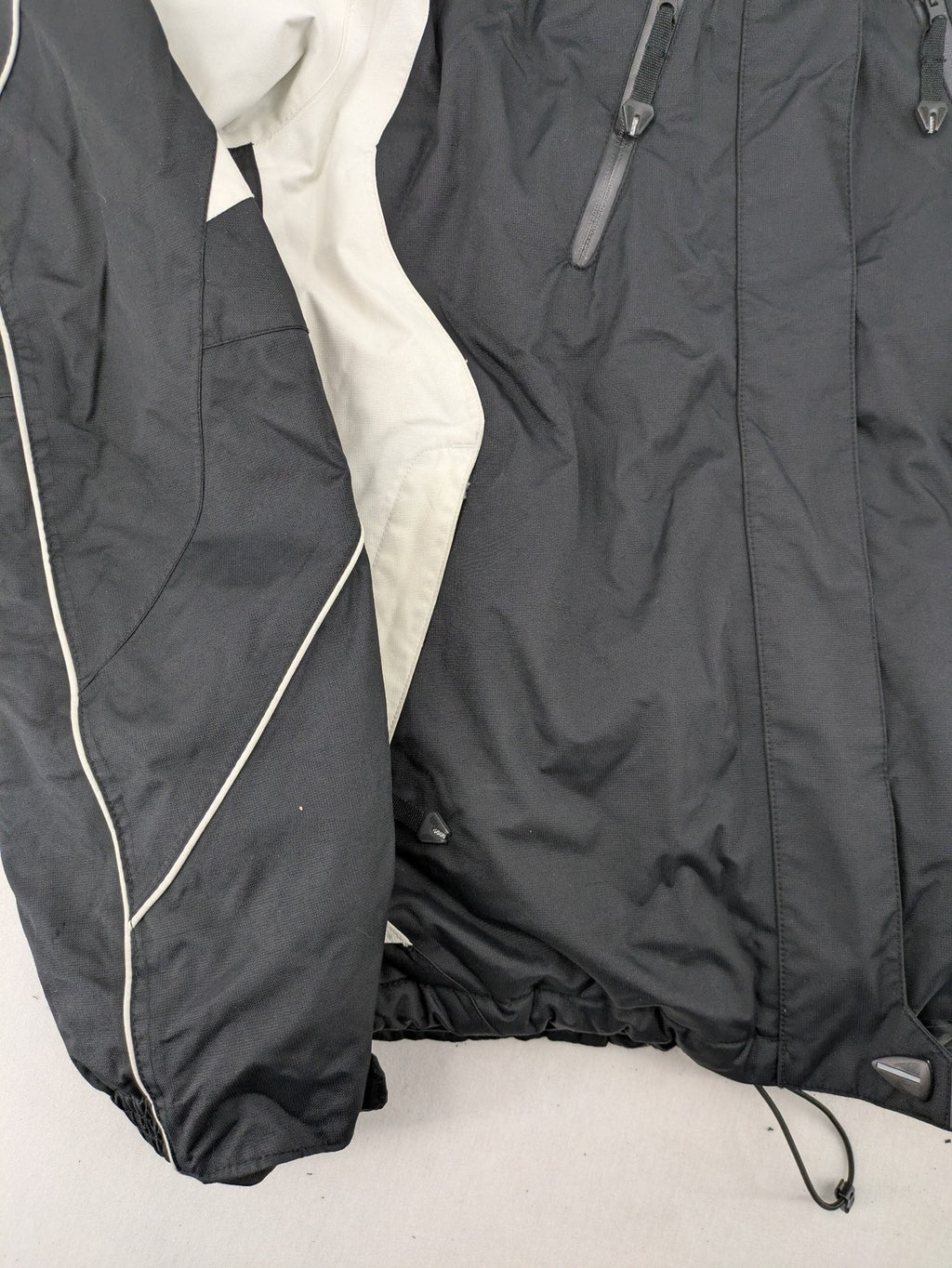 Icepeak black and white ski snowboard jacket with RECCO logo and quilted insulation.