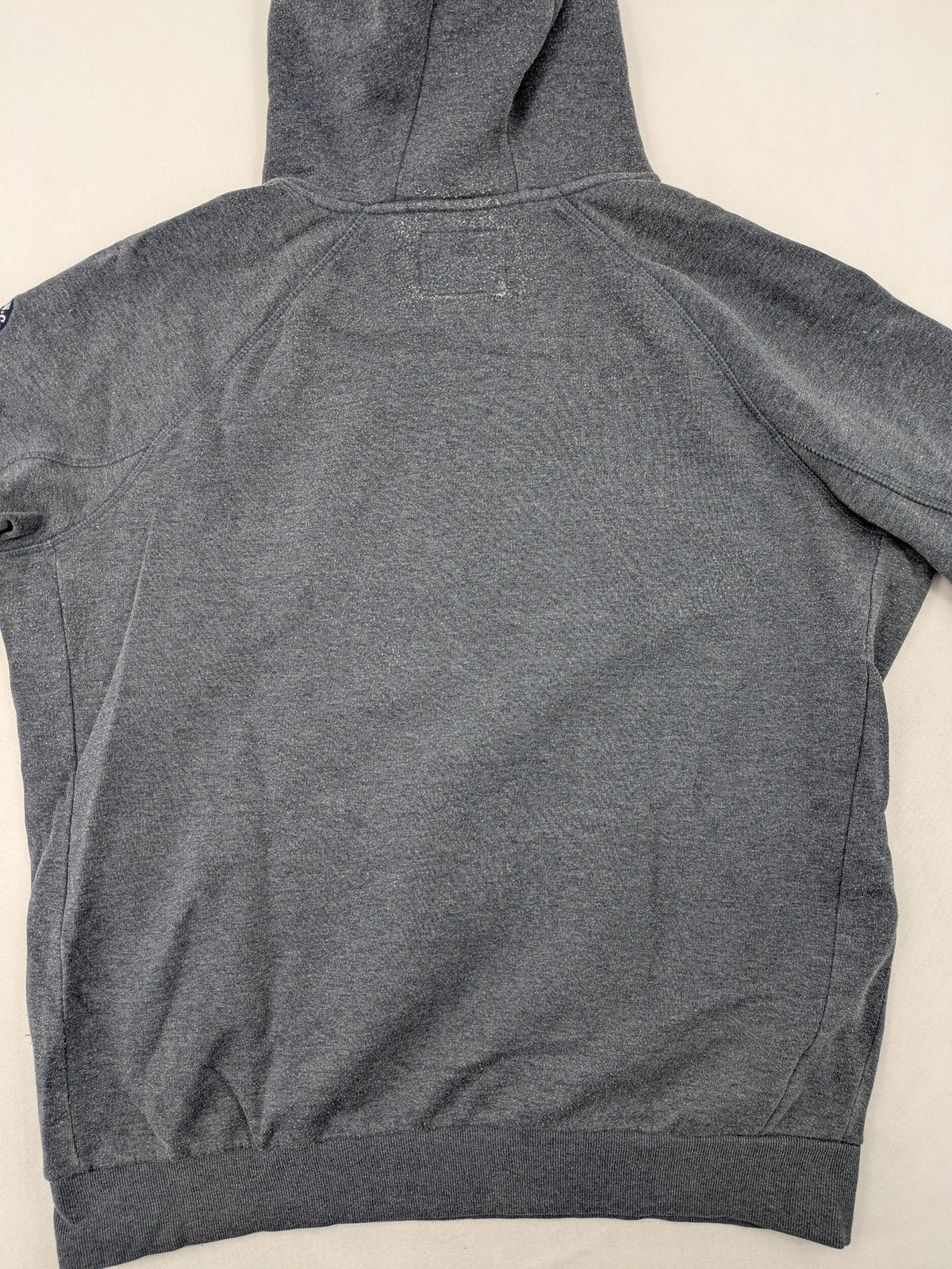 C&A grey hoodie with embossed chest logo, teddy-lined hood, and side zip pockets.