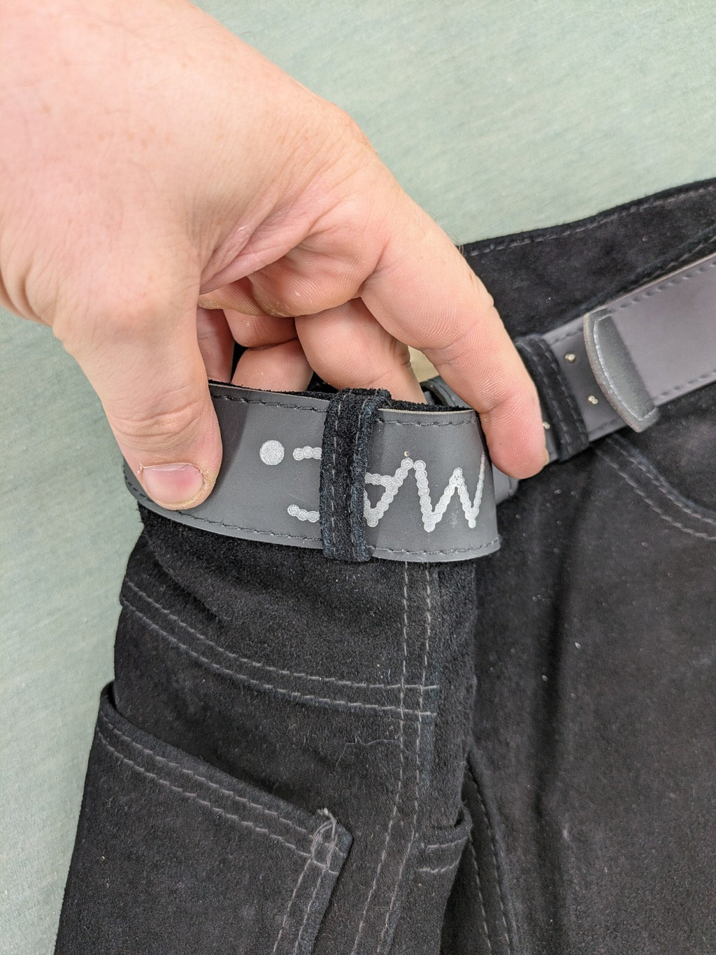 Silhouette black vintage pants high-waisted genuine suede five-pocket style with studded belt.