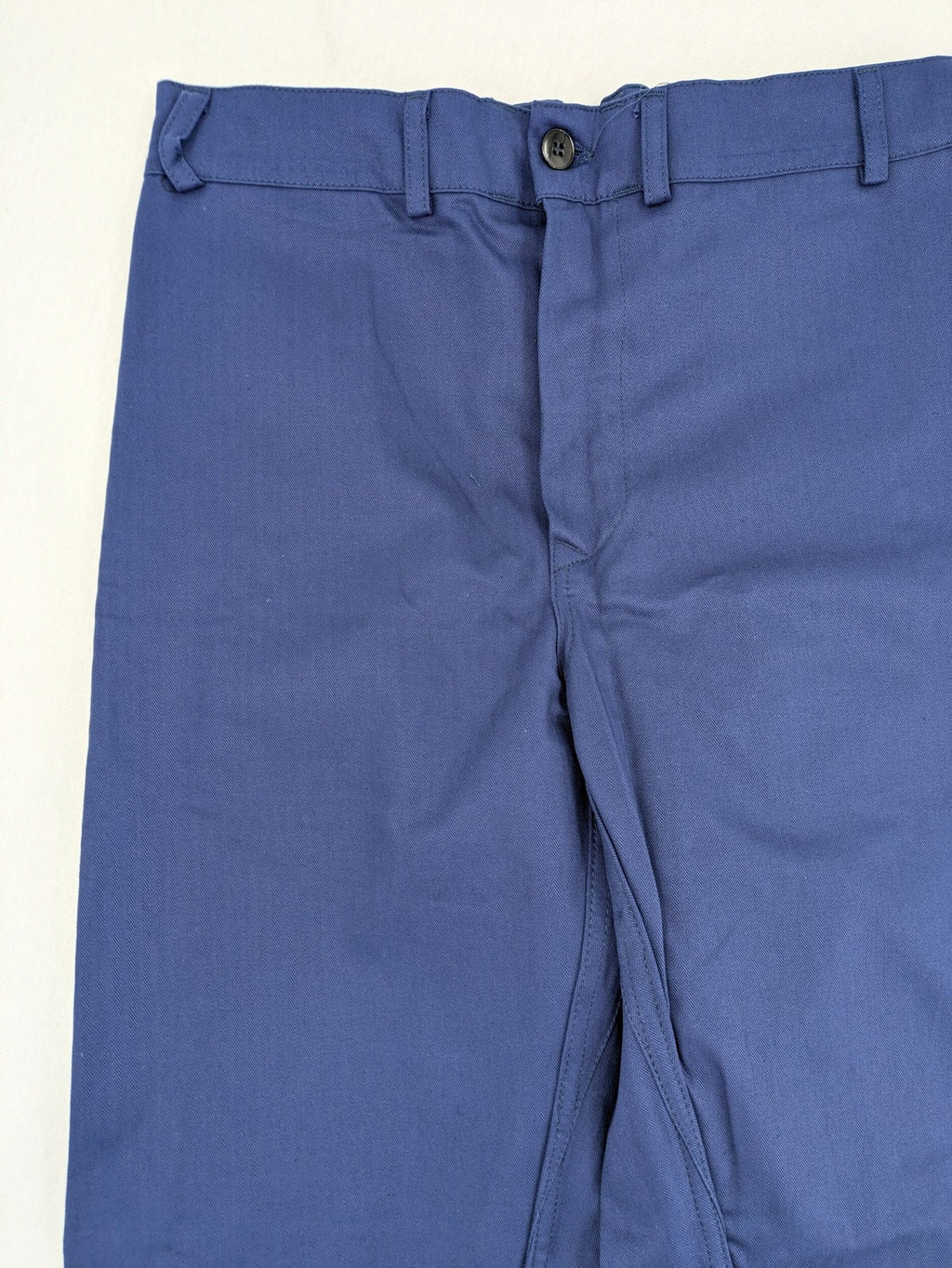 Uvex navy work trousers 100% cotton with button closure and belt loops.