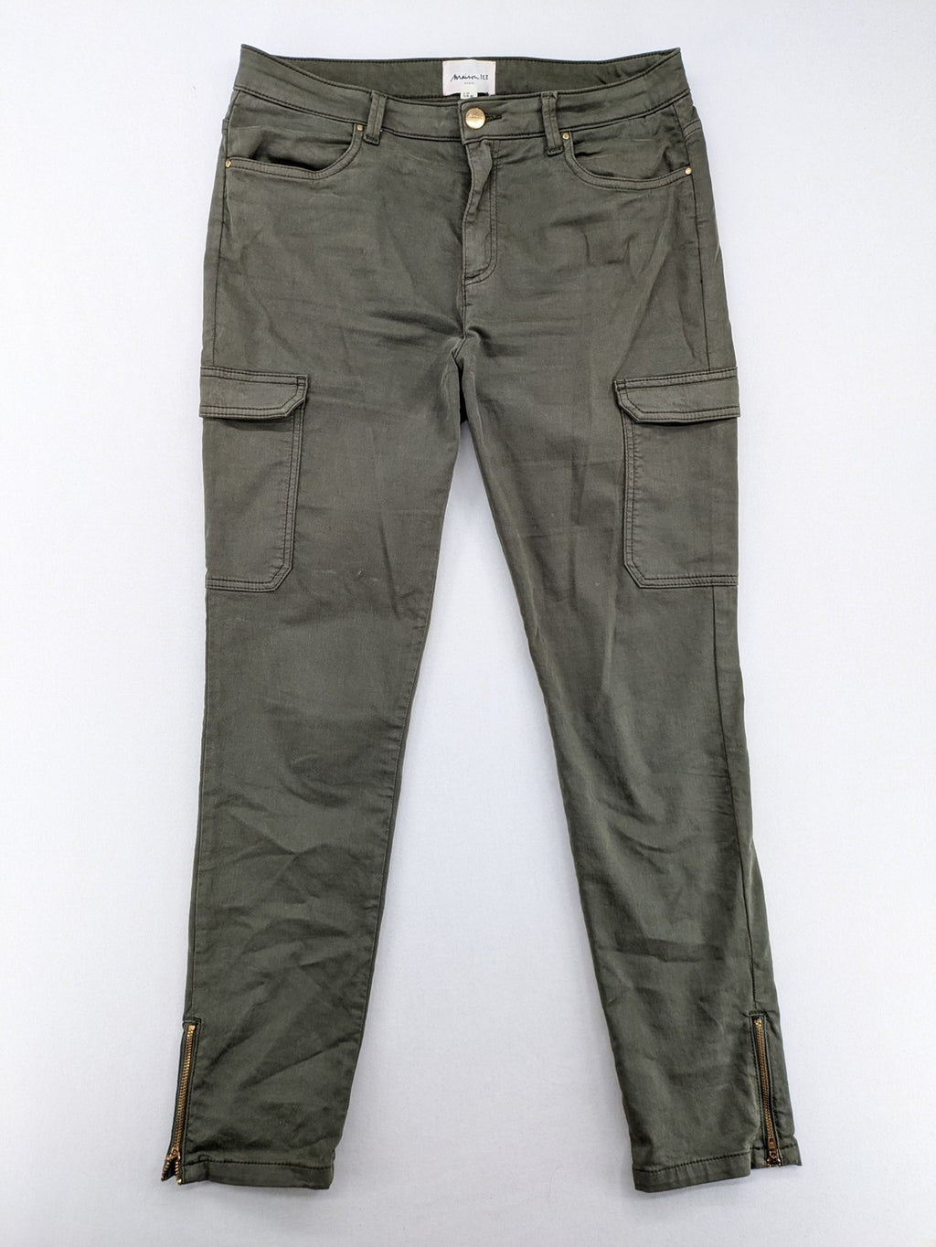 Maison 123 green cargo pants with ankle zippers and gold metal details.