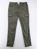 Maison 123 green cargo pants with ankle zippers and gold metal details.