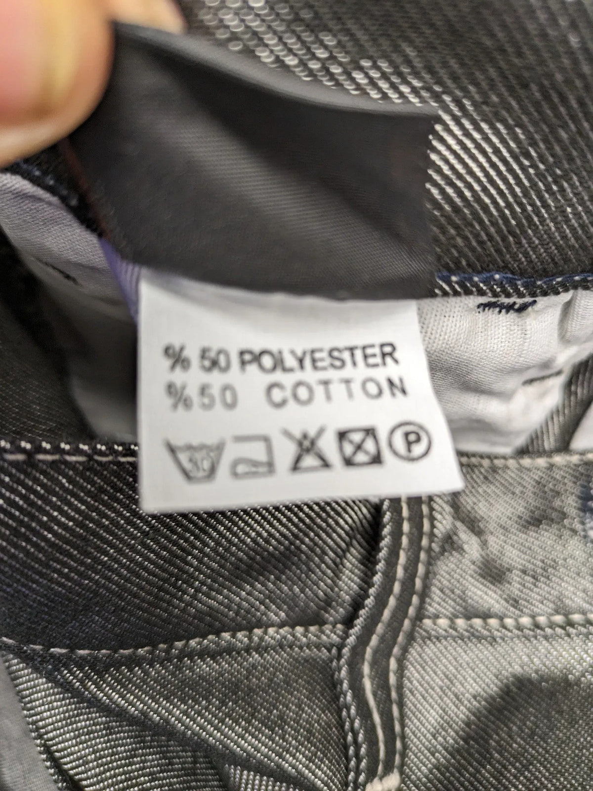 CIPO grey bootcut biker jeans with white contrast stitching and moto-inspired knee pleats.