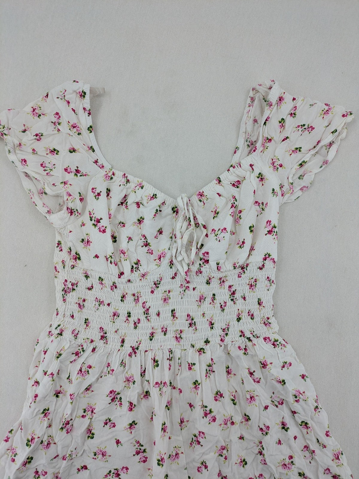 FB Sister floral playsuit white with pink flowers, smocked bodice, lightweight viscose material.