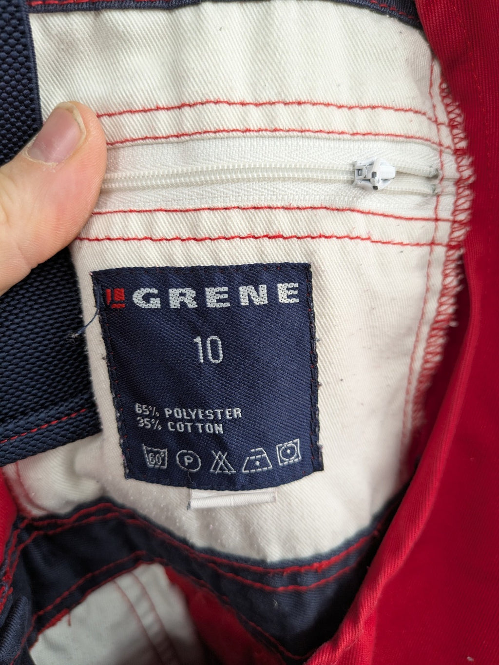 Grene navy red overall with adjustable straps, multiple pockets, and durable material.