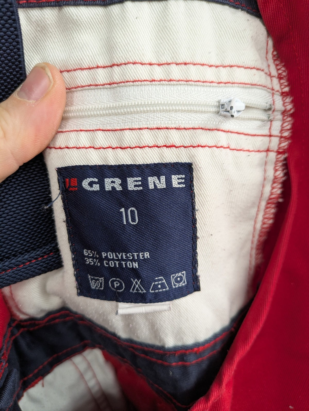Grene navy red overall with adjustable straps, multiple pockets, and durable material.