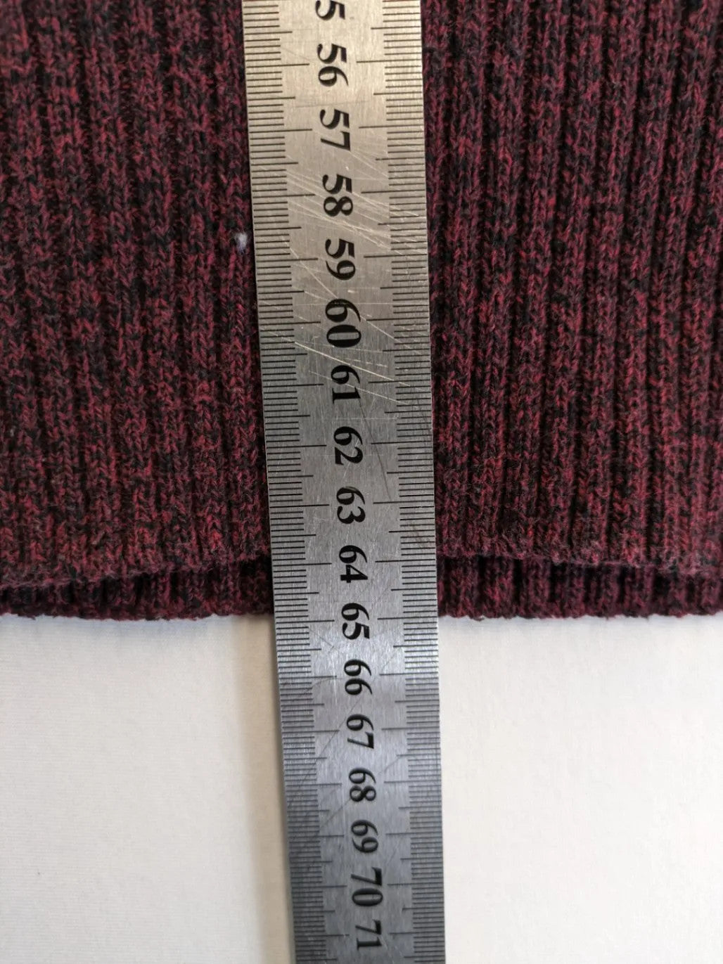 Infinity burgundy turtle neck jumper with quarter-zip and ribbed knit texture.
