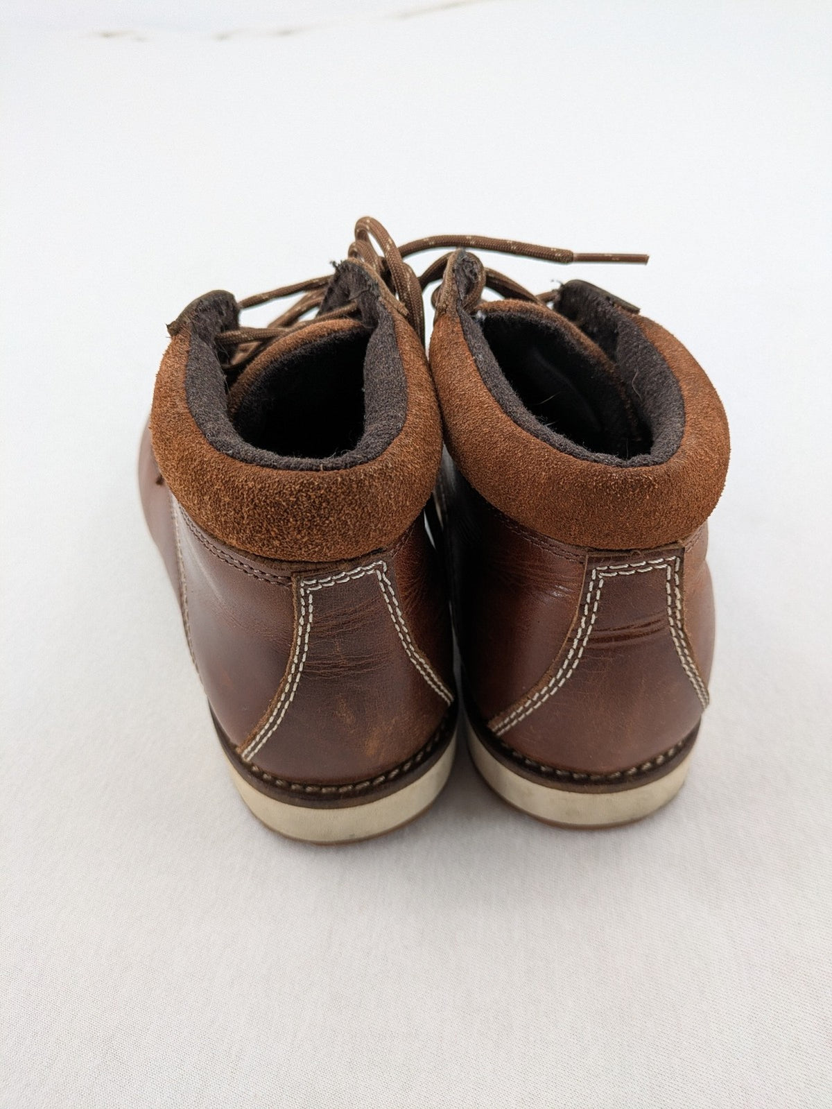 Firetrap brown motorcycle boots with classic lace-up design and padded ankle support.