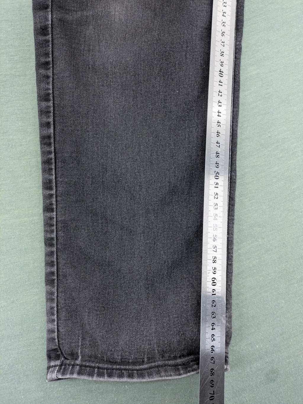 H&M grey slim fit jeans with adjustable waistband and faded wash detail.