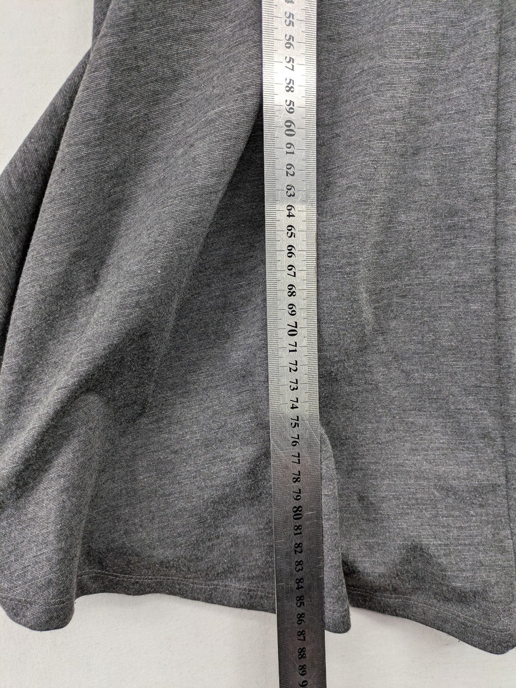 Ginatricot grey A-line skater dress with 3/4 sleeves and visible back zipper.