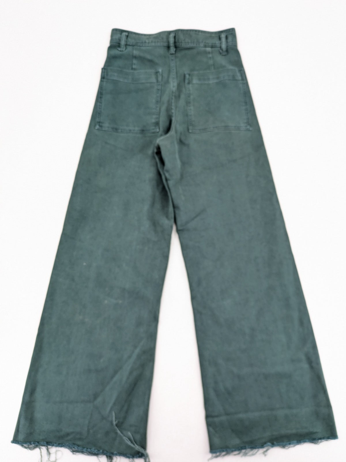Zara green high waist wide leg jeans with frayed hem and button closure.
