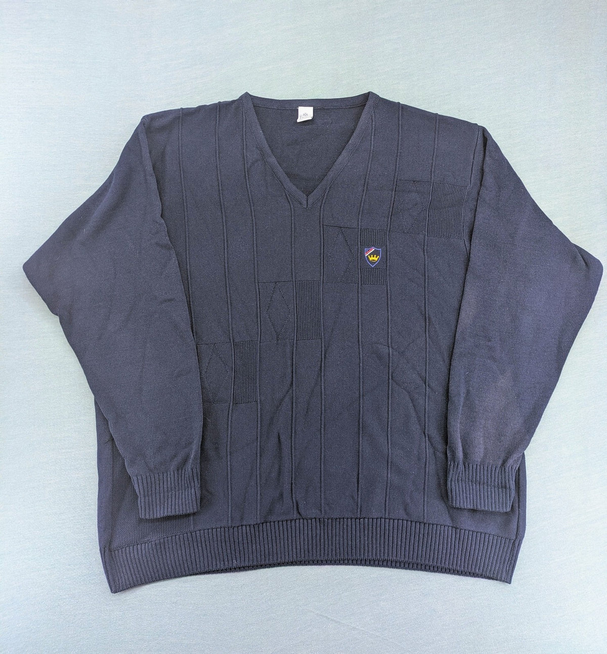 thomas lloyd navy turtle neck jumper with textured knit and embroidered crest logo