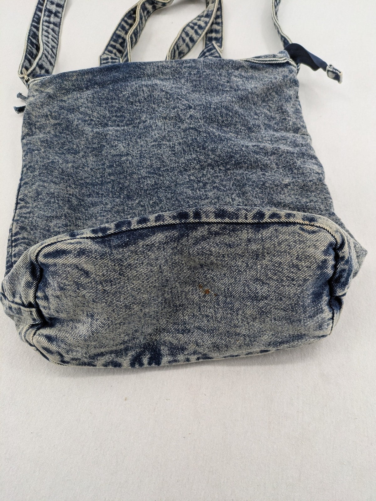 Clockhouse blue acid wash denim tote bag with adjustable shoulder strap and classic handles.