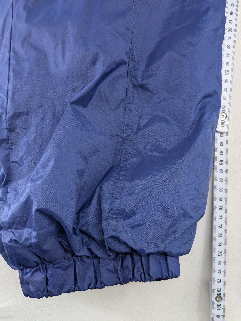 Shamp navy and yellow vintage ski jacket and pants set with retro design.