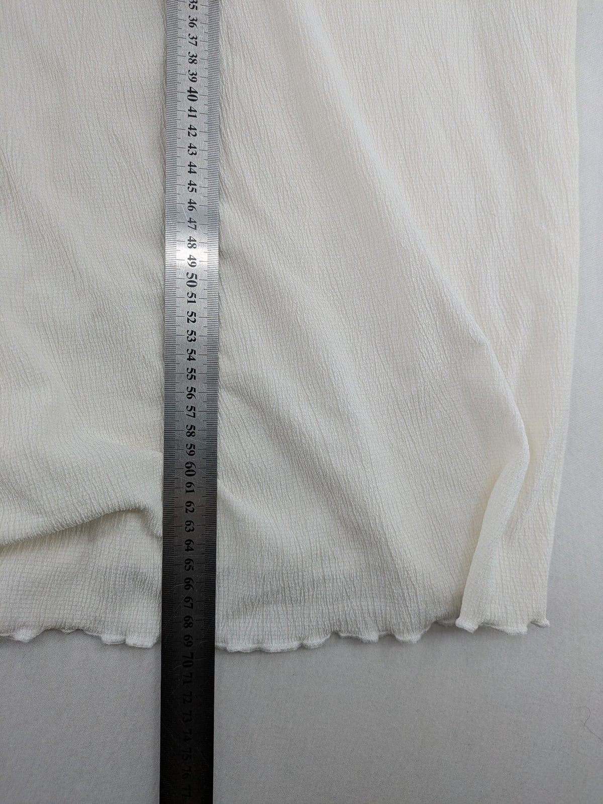 C&A cream blouse XXL textured crinkle fabric with gold button placket and wavy hem.