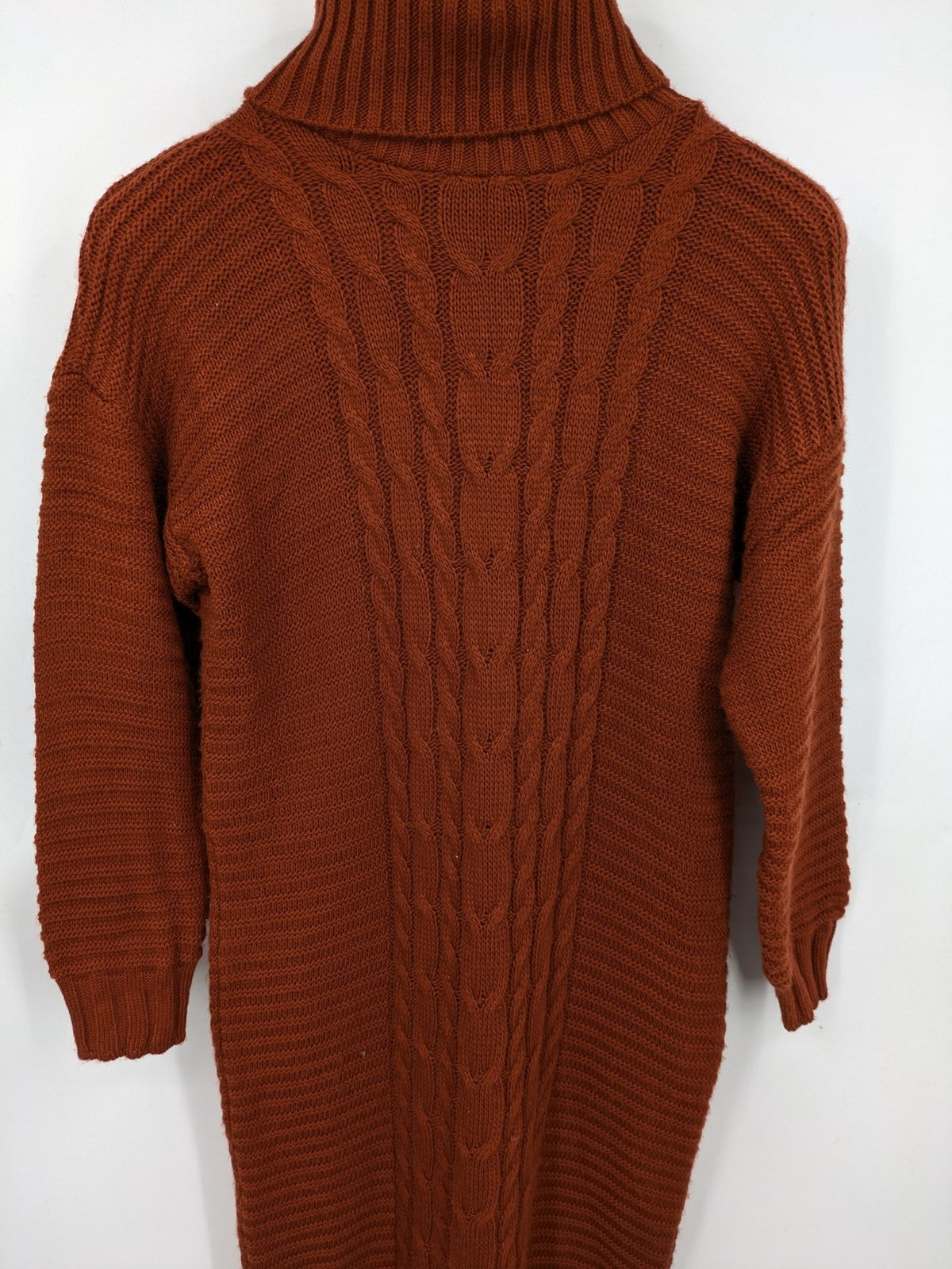 Braun brown turtle neck jumper with decorative cable knit pattern and long sleeves.