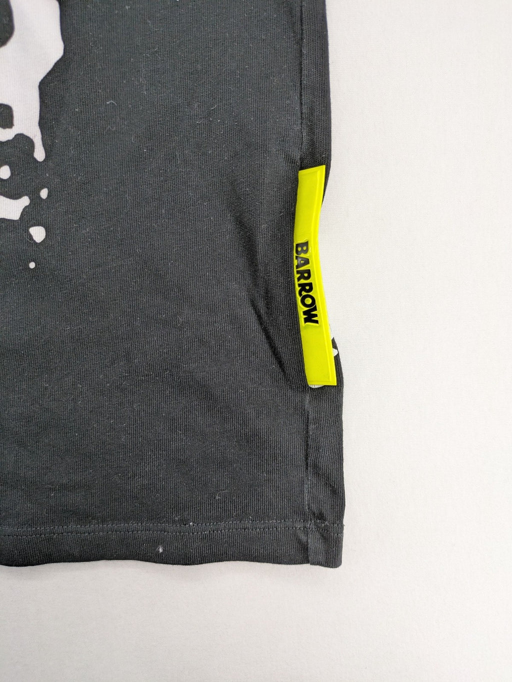 Barrow grey t-shirt with large black and white smiley graphic print and logo patch.