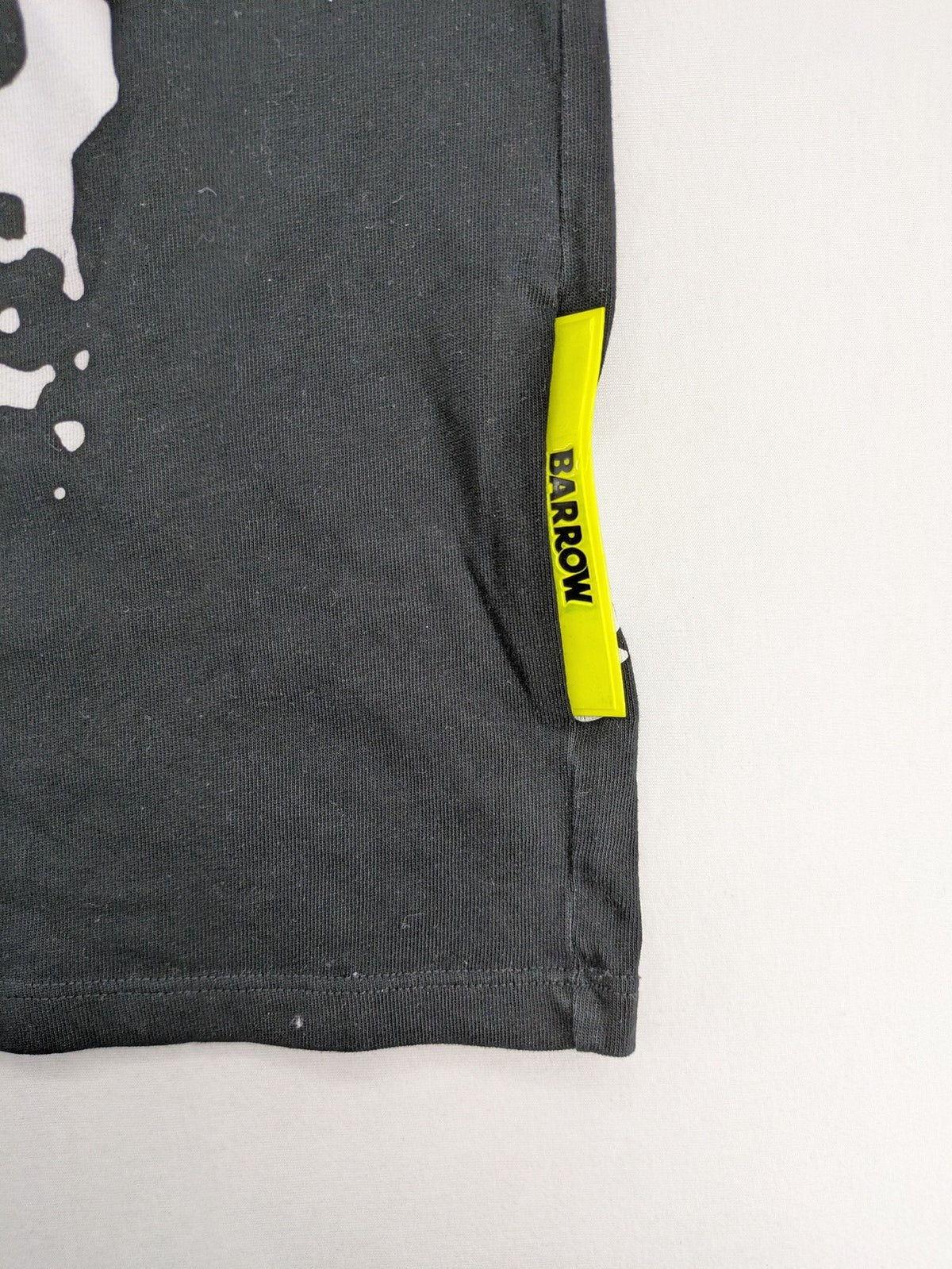 Barrow grey t-shirt with large black and white smiley graphic print and logo patch.