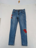 Jennyfer pink skinny jeans with distressed details and red rose embroidery on hips and knees.