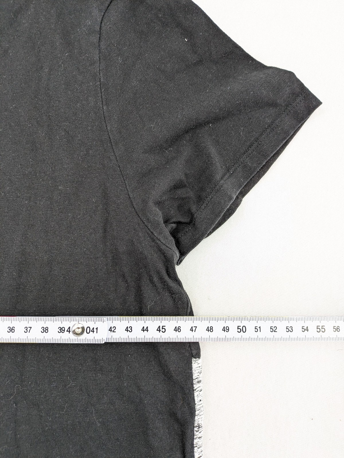 Angelo Litrico black and grey colorblock t-shirt with logo accents and soft cotton blend.