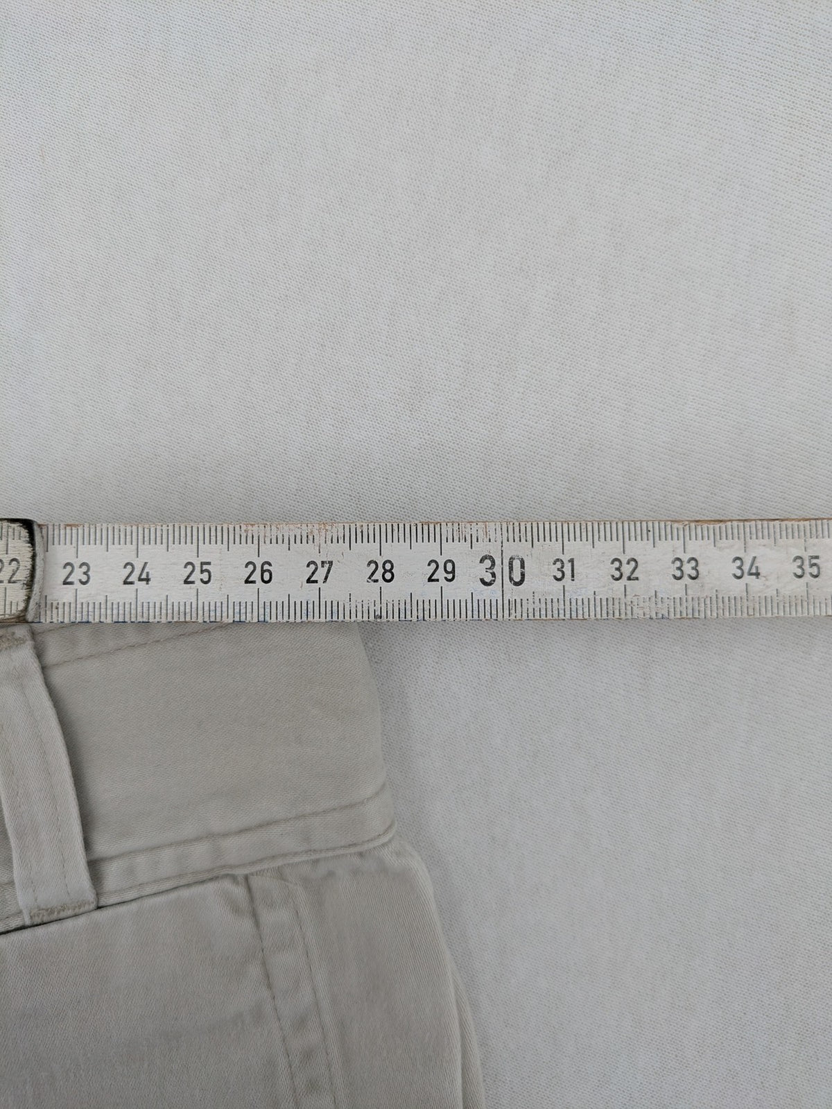 H&M L.O.G.G beige bootcut pants with double button closure and stretch cotton material.