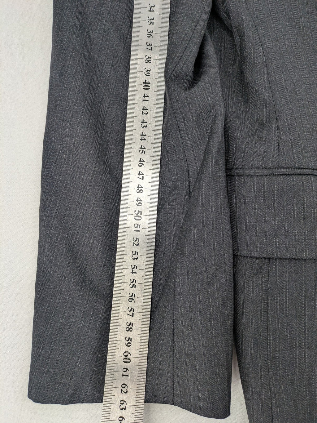 Desch grey blazer with dark grey pinstripe pattern, satin lining, and tailored design.
