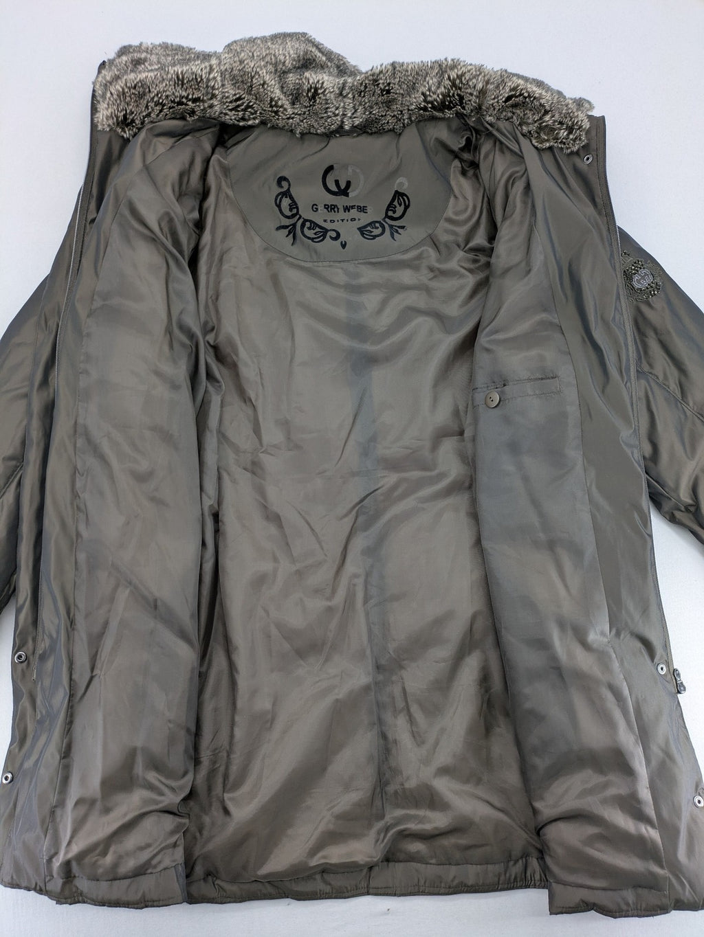 Gerry Weber Edition grey quilted coat with faux fur collar and metal toggle closures.