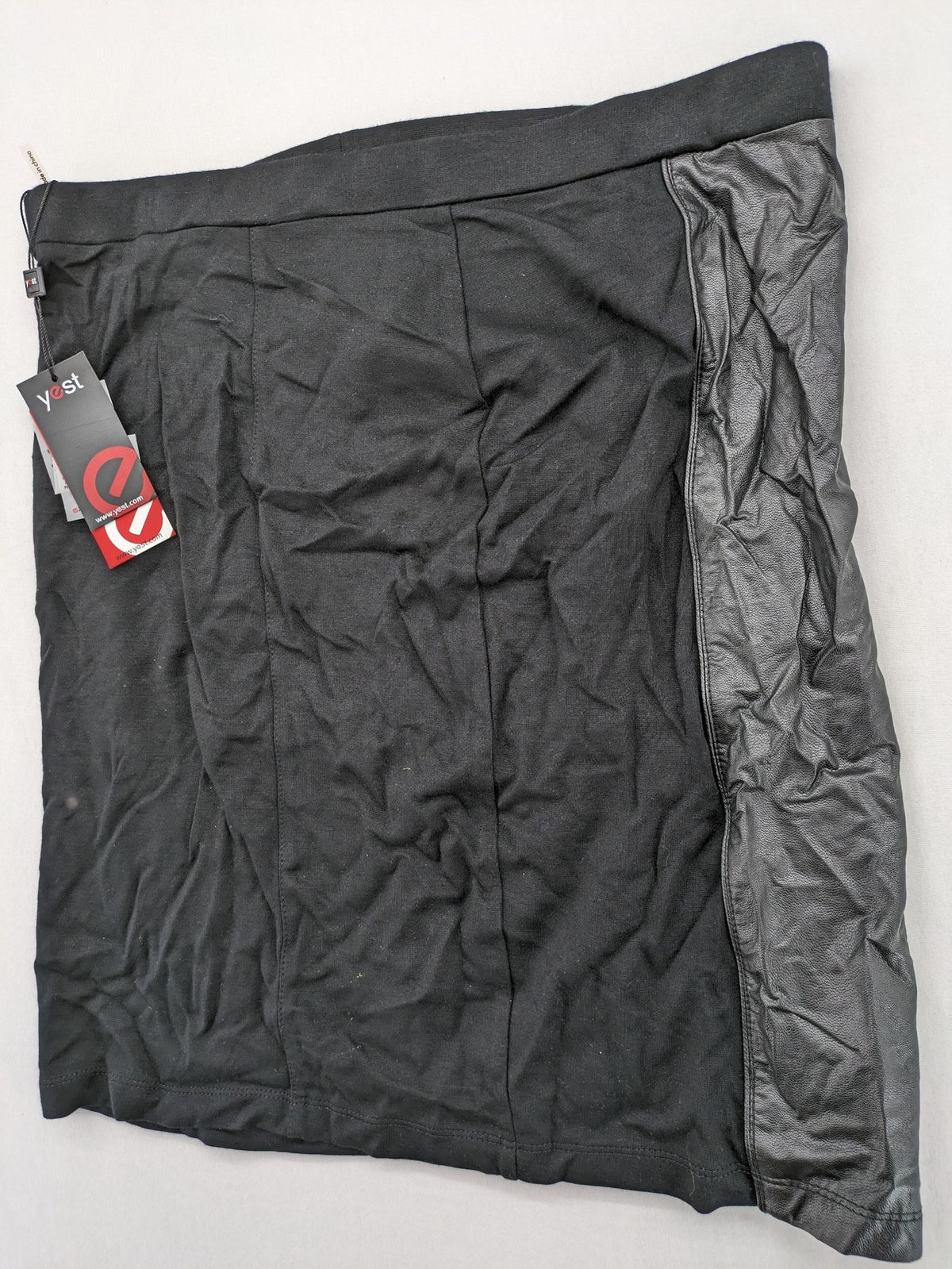 Yest black long skirt with grey faux leather panel and stretchy fabric.